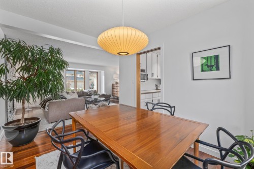Dining area with dark wood finished floors and baseboards - 175 Roy Street, Edmonton, AB - Indoor Photo Showing Dining Room