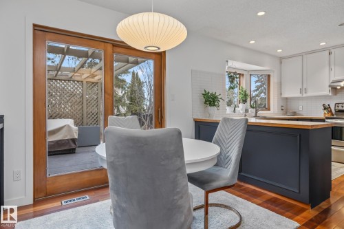 Dining space with dark wood finished floors and recessed lighting - 175 Roy Street, Edmonton, AB - Indoor