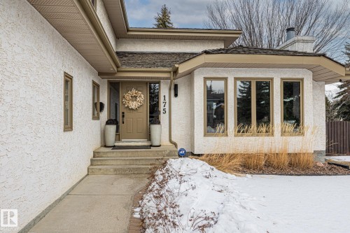 Property entrance with stucco siding and a chimney - 175 Roy Street, Edmonton, AB - Outdoor