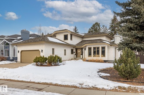 View of front of home with a garage and stucco siding - 175 Roy Street, Edmonton, AB - Outdoor With Facade