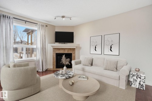 2424 Casselman Crescent, Edmonton, AB - Indoor Photo Showing Living Room With Fireplace