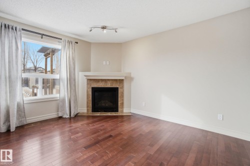2424 Casselman Crescent, Edmonton, AB - Indoor Photo Showing Living Room With Fireplace