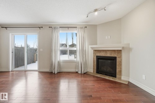 2424 Casselman Crescent, Edmonton, AB - Indoor Photo Showing Living Room With Fireplace