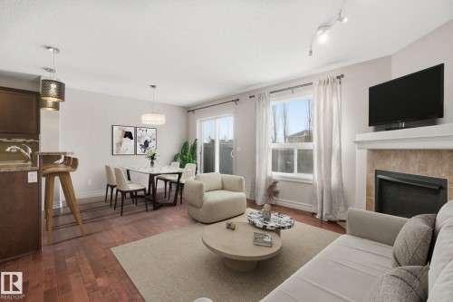 2424 Casselman Crescent, Edmonton, AB - Indoor Photo Showing Living Room With Fireplace