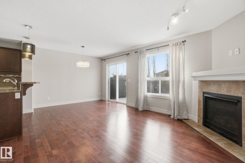 2424 Casselman Crescent, Edmonton, AB - Indoor Photo Showing Living Room With Fireplace