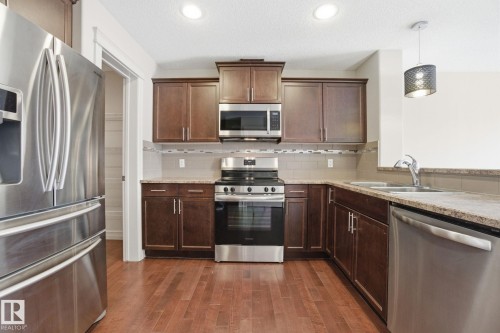 2424 Casselman Crescent, Edmonton, AB - Indoor Photo Showing Kitchen With Stainless Steel Kitchen With Double Sink