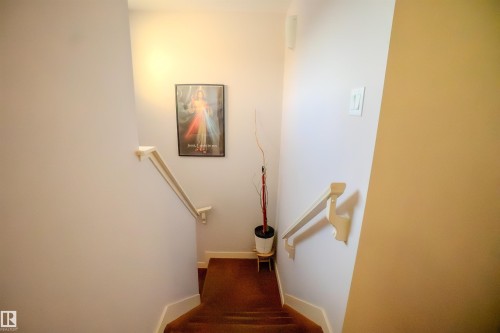 Stairs with baseboards - 5244 1A Avenue Sw, Edmonton, AB - Indoor Photo Showing Other Room