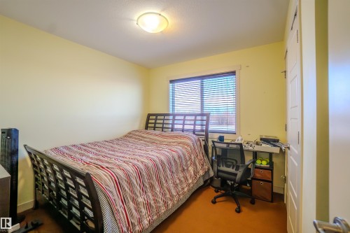 Bedroom with carpet - 5244 1A Avenue Sw, Edmonton, AB - Indoor Photo Showing Bedroom