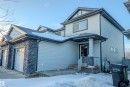View of front facade featuring stone siding and an attached garage - 5244 1A Avenue Sw, Edmonton, AB  - Outdoor 