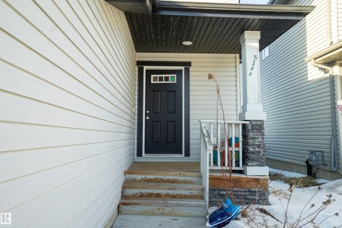 View of exterior entry with a porch - 5244 1A Avenue Sw, Edmonton, AB - Outdoor With Exterior