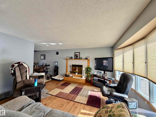 4802 Mackenzie Av, Drayton Valley, AB - Indoor Photo Showing Living Room With Fireplace