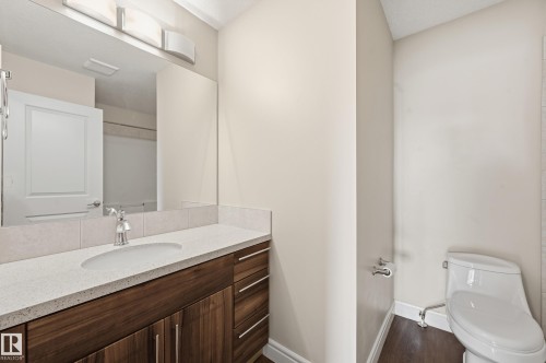 Bathroom with vanity and dark wood-style floors - 1349 Cunningham Drive, Edmonton, AB - Indoor Photo Showing Bathroom