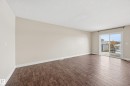 Spare room featuring dark wood-type flooring and a textured ceiling - 1351 Cunningham Drive, Edmonton, AB  - Indoor Photo Showing Other Room 