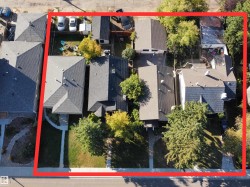 Aerial view of residential area featuring property boundaries highlighted - 