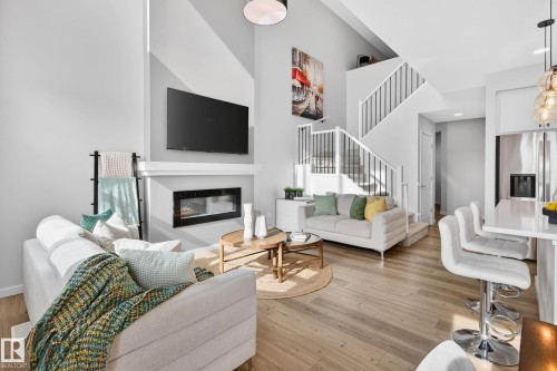 324 Stiles Way, Leduc, AB - Indoor Photo Showing Living Room With Fireplace