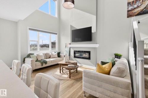 324 Stiles Way, Leduc, AB - Indoor Photo Showing Living Room With Fireplace