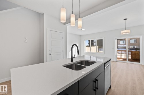 144 Honeysuckle Green, Leduc, AB - Indoor Photo Showing Kitchen With Double Sink