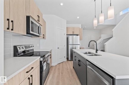 144 Honeysuckle Green, Leduc, AB - Indoor Photo Showing Kitchen With Double Sink With Upgraded Kitchen
