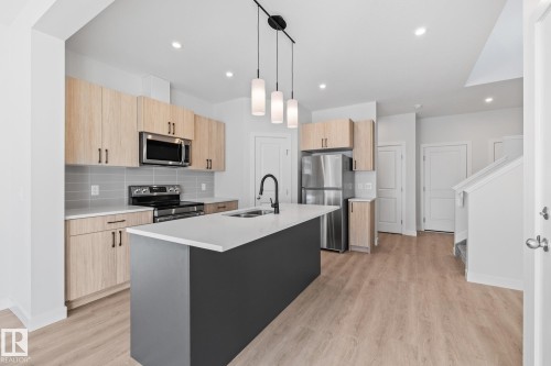 144 Honeysuckle Green, Leduc, AB - Indoor Photo Showing Kitchen With Double Sink With Upgraded Kitchen
