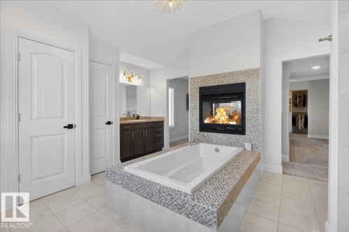 1440 Chahley Place, Edmonton, AB - Indoor Photo Showing Bathroom With Fireplace