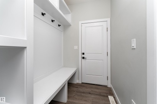 Mudroom featuring dark wood finished floors and baseboards - 5211 Kimball Crescent, Edmonton, AB - Indoor Photo Showing Other Room