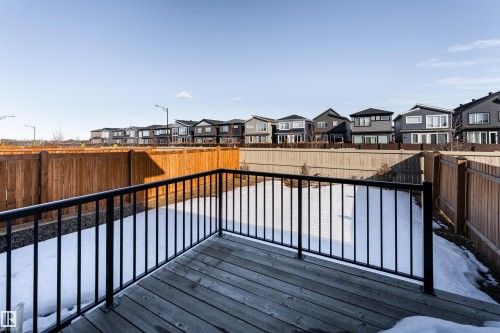 Wooden terrace featuring a residential view and a fenced backyard - 5211 Kimball Crescent, Edmonton, AB - Outdoor