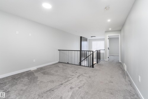 Empty room featuring light carpet and recessed lighting - 5211 Kimball Crescent, Edmonton, AB - Indoor Photo Showing Other Room