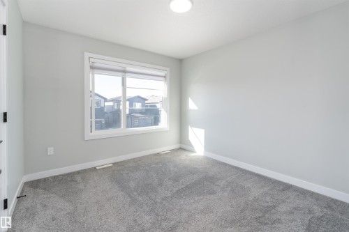 Carpeted empty room featuring baseboards - 5211 Kimball Crescent, Edmonton, AB - Indoor Photo Showing Other Room