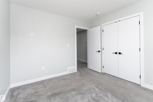 Unfurnished bedroom with carpet floors and a closet - 5211 Kimball Crescent, Edmonton, AB - Indoor Photo Showing Other Room