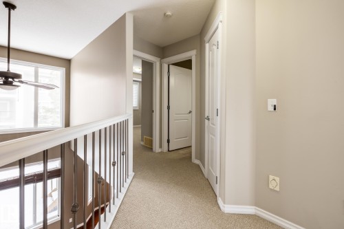 Hall with light colored carpet and baseboards - 11622 11 Avenue, Edmonton, AB - Indoor Photo Showing Other Room