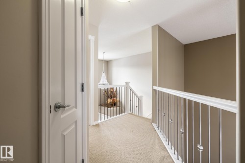 Corridor with light colored carpet - 11622 11 Avenue, Edmonton, AB - Indoor Photo Showing Other Room
