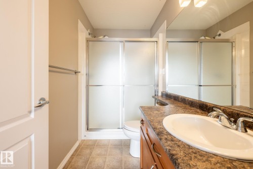 Full bathroom with vanity, a stall shower, and light tile patterned flooring - 11622 11 Avenue, Edmonton, AB - Indoor Photo Showing Bathroom