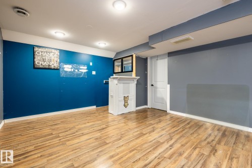 Finished basement featuring light wood-style flooring - 11622 11 Avenue, Edmonton, AB - Indoor Photo Showing Other Room