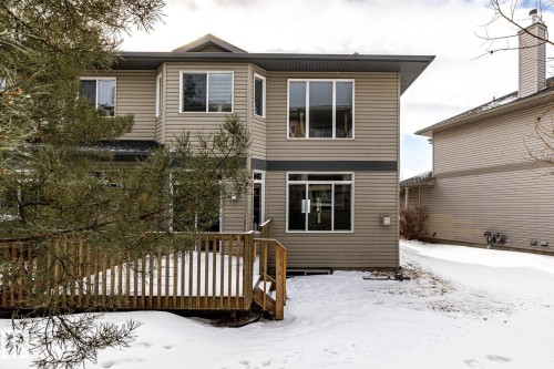 Snow covered back of property featuring a wooden deck - 11622 11 Avenue, Edmonton, AB - Outdoor