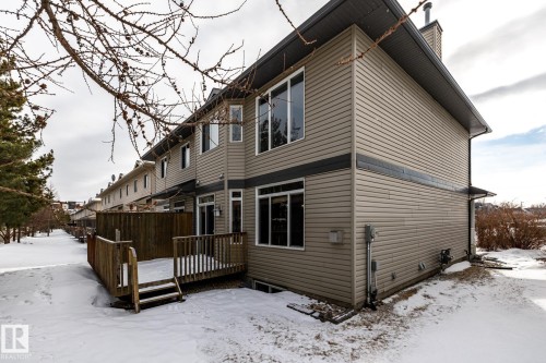 Snow covered back of property with a wooden deck - 11622 11 Avenue, Edmonton, AB - Outdoor