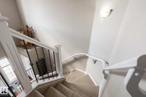 Staircase with carpet flooring - 11622 11 Avenue, Edmonton, AB - Indoor Photo Showing Other Room