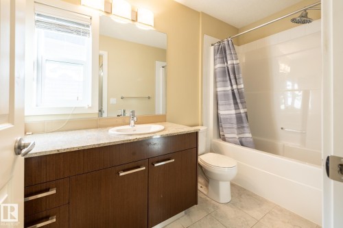 Bathroom featuring vanity and shower / tub combo - 21 655 Watt Boulevard, Edmonton, AB - Indoor Photo Showing Bathroom