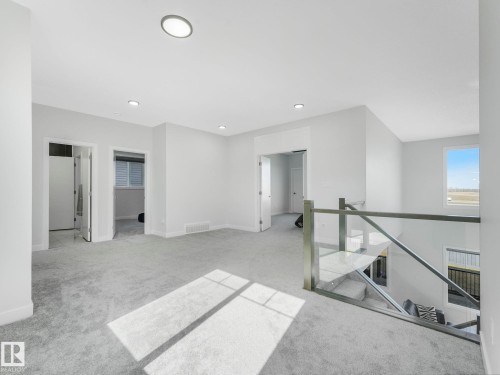 Empty room with light carpet and recessed lighting - 1104 152 Avenue, Edmonton, AB - Indoor Photo Showing Other Room