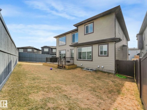 Back of property featuring a wooden deck and a fenced backyard - 1104 152 Avenue, Edmonton, AB - Outdoor With Exterior