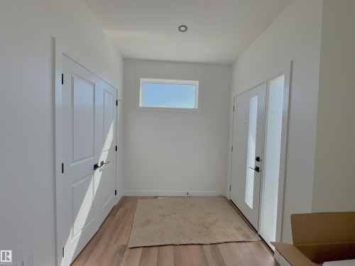 Foyer featuring light wood-type flooring - 7 Tilia Place, Spruce Grove, AB - Indoor Photo Showing Other Room