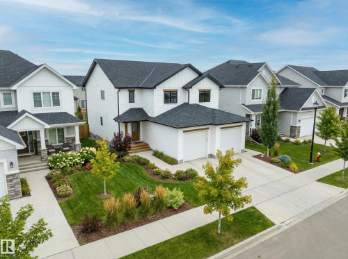 Neighboring homes and landscaping is not accurate to the property. Digital rendering only. - A 9315 99 Avenue, Westlock, AB - Outdoor With Facade