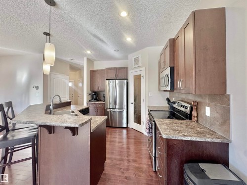 29 Heron Crescent, Spruce Grove, AB - Indoor Photo Showing Kitchen With Stainless Steel Kitchen With Upgraded Kitchen