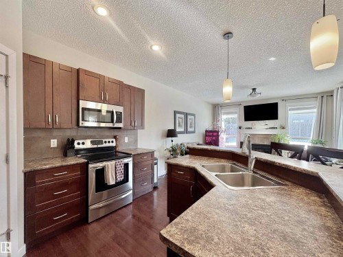 29 Heron Crescent, Spruce Grove, AB - Indoor Photo Showing Kitchen With Stainless Steel Kitchen With Double Sink With Upgraded Kitchen