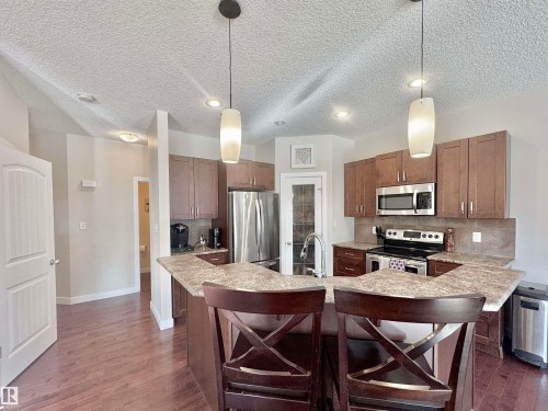 29 Heron Crescent, Spruce Grove, AB - Indoor Photo Showing Kitchen With Stainless Steel Kitchen With Double Sink With Upgraded Kitchen