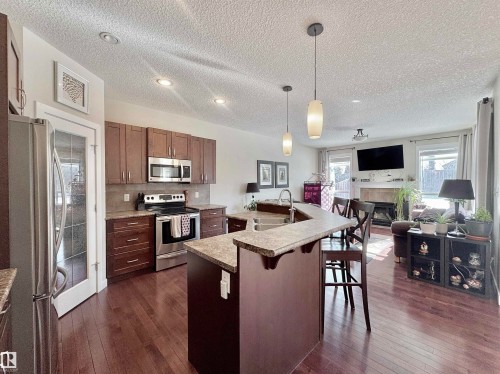 29 Heron Crescent, Spruce Grove, AB - Indoor Photo Showing Kitchen With Stainless Steel Kitchen With Double Sink With Upgraded Kitchen