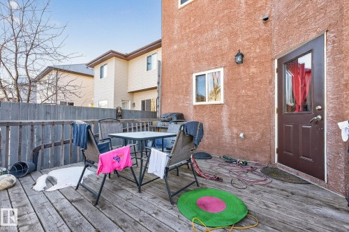 Wooden deck featuring outdoor dining area - 1660 Malone Way, Edmonton, AB - Outdoor With Deck Patio Veranda With Exterior