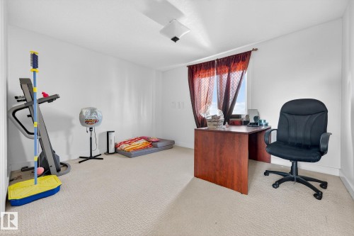 Office space with light colored carpet and baseboards - 1660 Malone Way, Edmonton, AB - Indoor Photo Showing Other Room