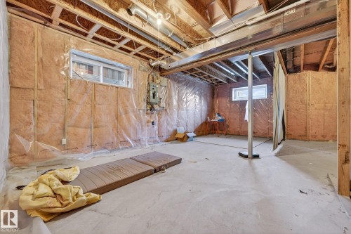 Below grade area featuring electric panel - 1660 Malone Way, Edmonton, AB - Indoor Photo Showing Basement