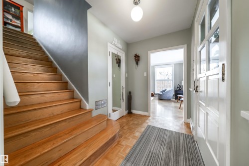 Foyer with stairway and parquet floors - 10445 134 Street, Edmonton, AB - Indoor Photo Showing Other Room