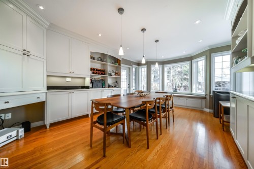 Dining room featuring crown molding, light wood-style floors, and recessed lighting - 10445 134 Street, Edmonton, AB - Indoor